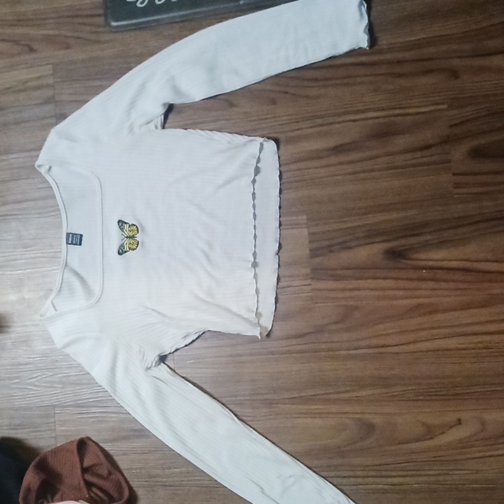 white crop top with a butterfly at the top